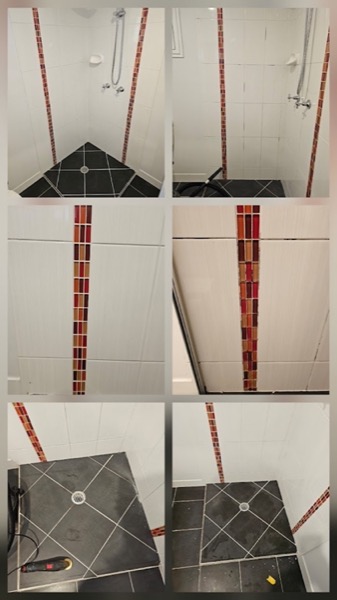 Tiled bathroom walls with a mosaic feature strip and a tiled shower base